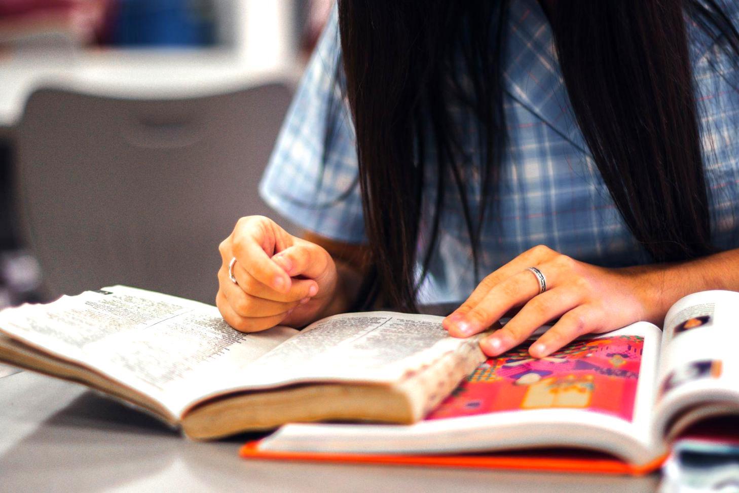 Students working on financial planning exercises in classroom setting